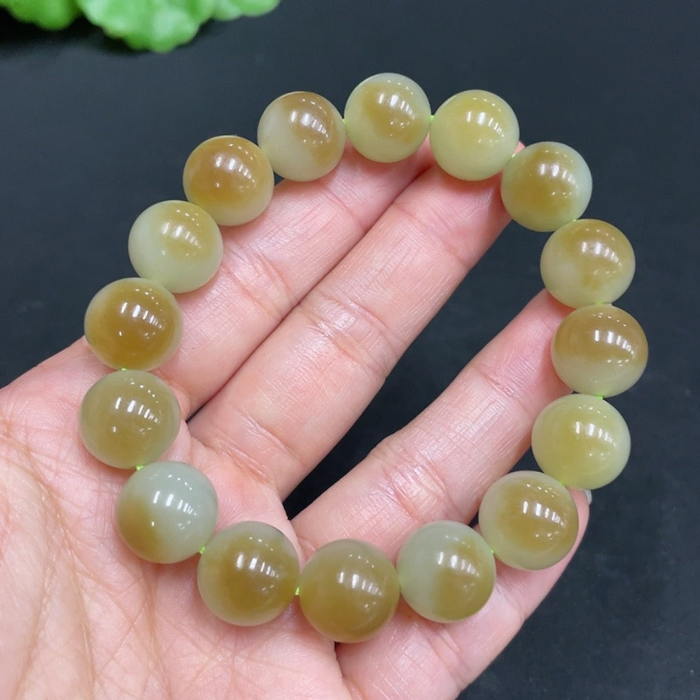 Hetian Jade bracelet with 11.9mm beads, weighing 41.7g, crafted by HUILIU HQ, showcasing smooth, polished jade stones.