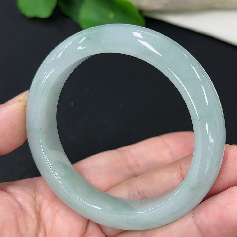Jadeite round bangle with a size of 53.7, weighing approximately 56.5g, featuring a smooth, polished surface from HKHQ.