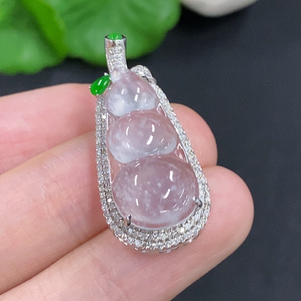 Jadeite lucky bean pendant with 18K gold and diamond accents, showing intricate craftsmanship and polished finish.