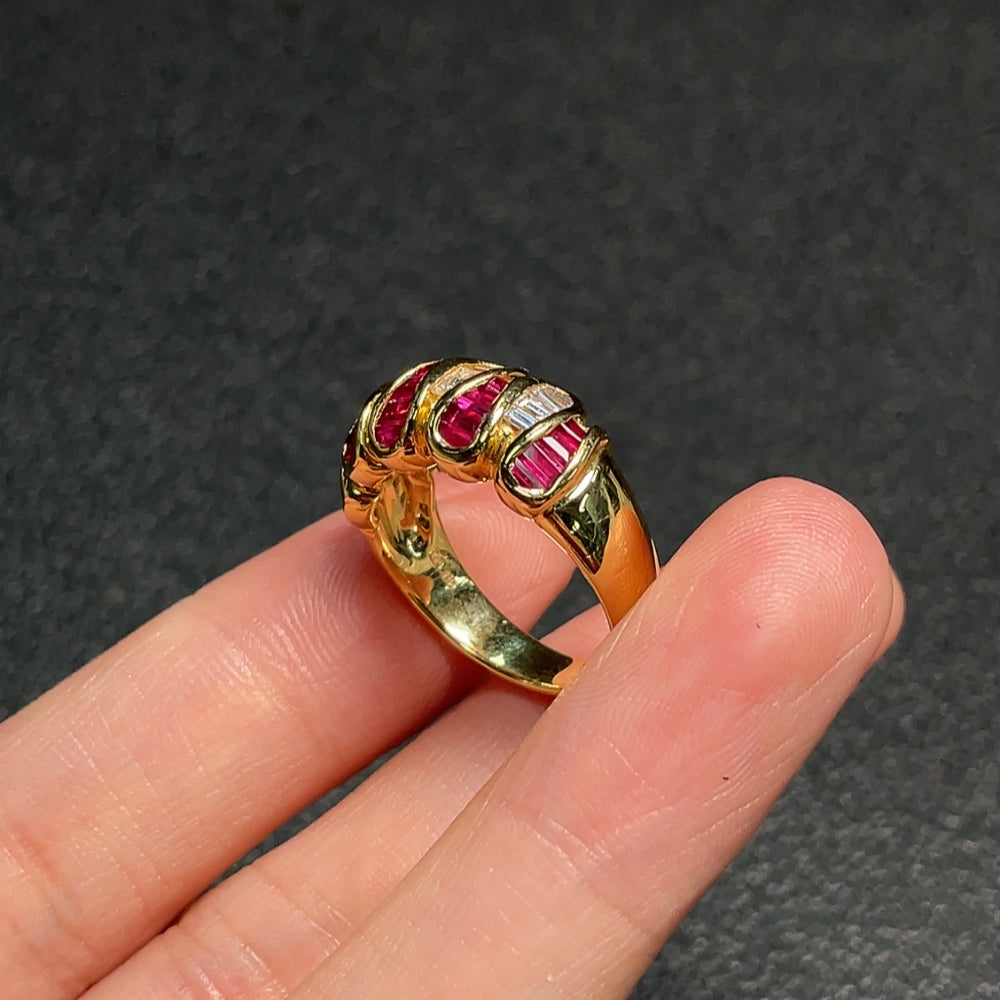 Huiliu Ruby ring with diamond accents, featuring vibrant red gemstones and sparkling diamond details on a gold band.
