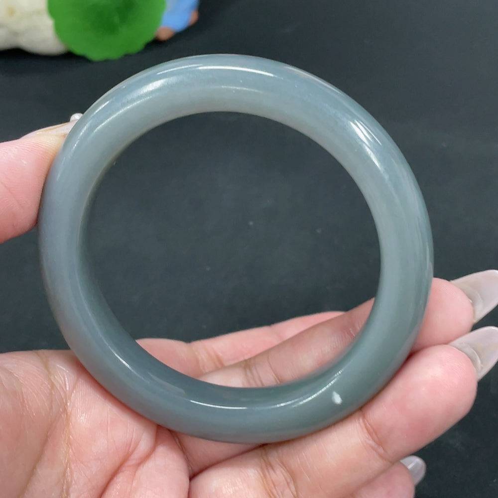 Huiliu Certified Hetian Jade round bracelet featuring smooth, polished jade beads on a delicate string.