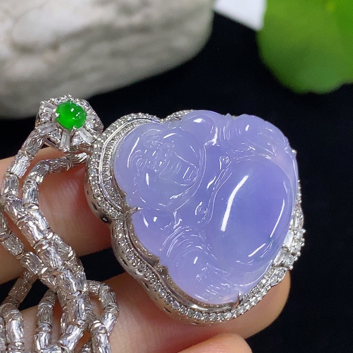 Jadeite Buddha pendant necklace by HKHQ with 18K gold accents and diamond details, showcasing a detailed Buddha figure.