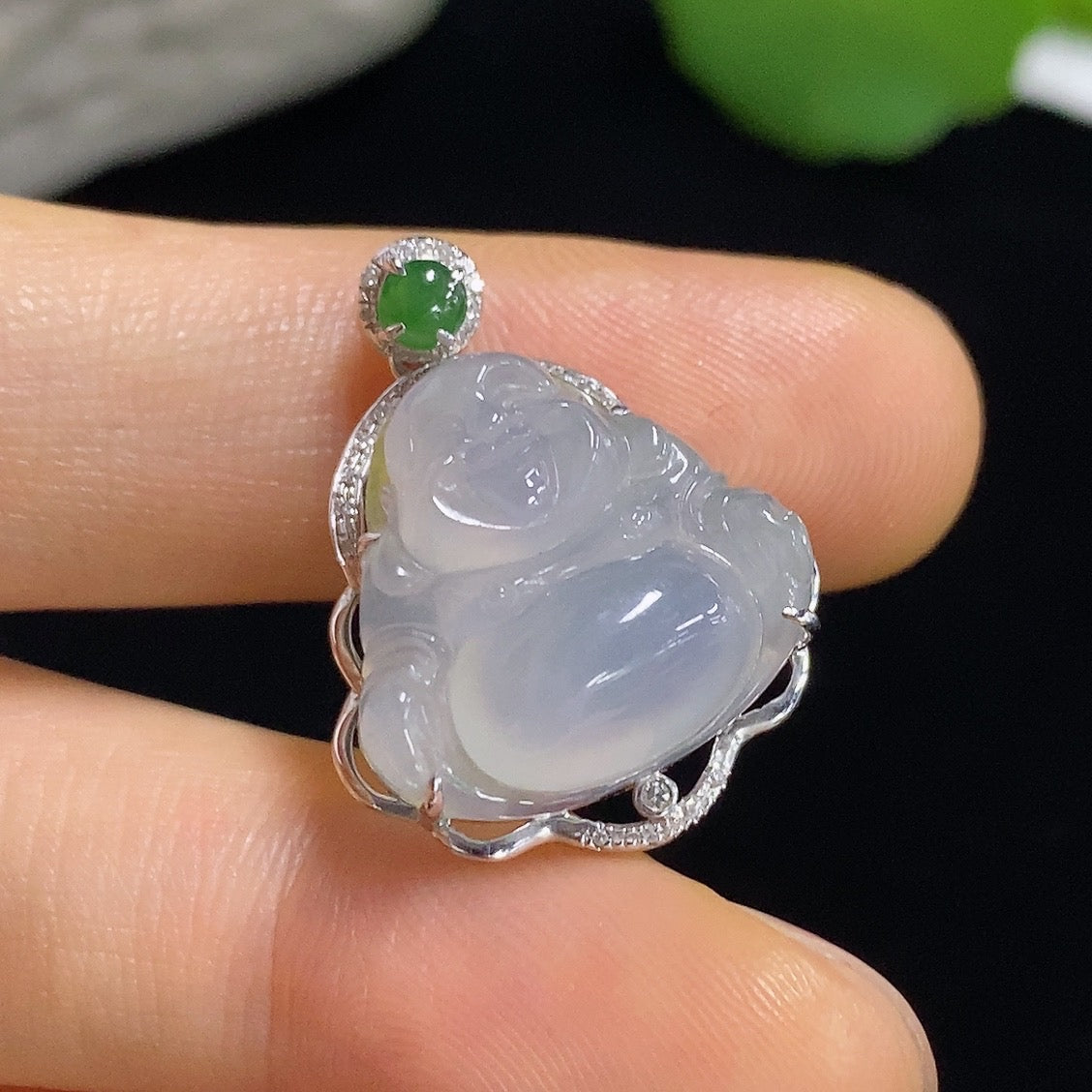 Jadeite Buddha pendant with 18k gold accents and diamond details, showcasing the intricate design and craftsmanship.