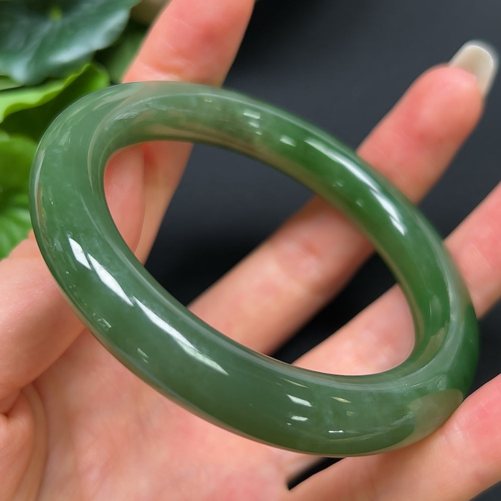 HKHQ Hetian Jade round bangle in size 55.4 with a weight of 56.99g, showcasing smooth, polished jade bracelet on a neutral background.