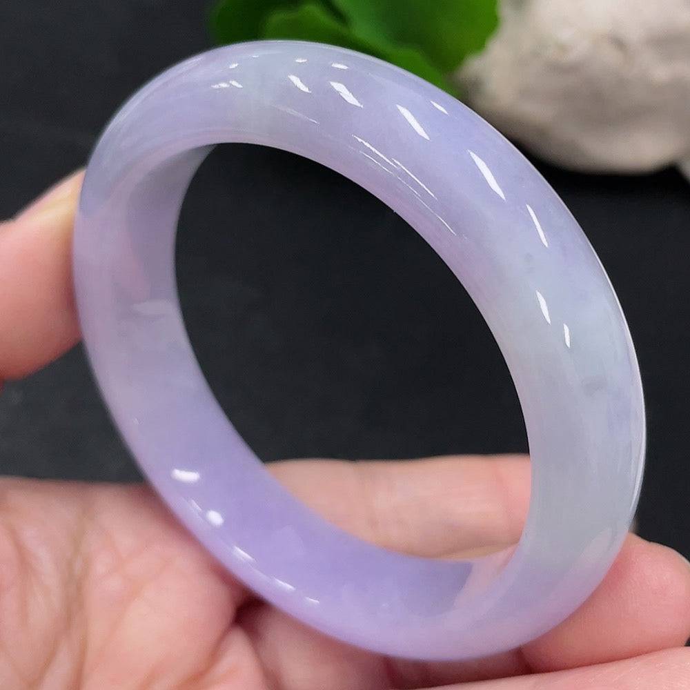 Jadeite round bangle in size 54.3, weighing approximately 56.8g, crafted by HUILIU HQ, showcasing smooth, polished jade surface.