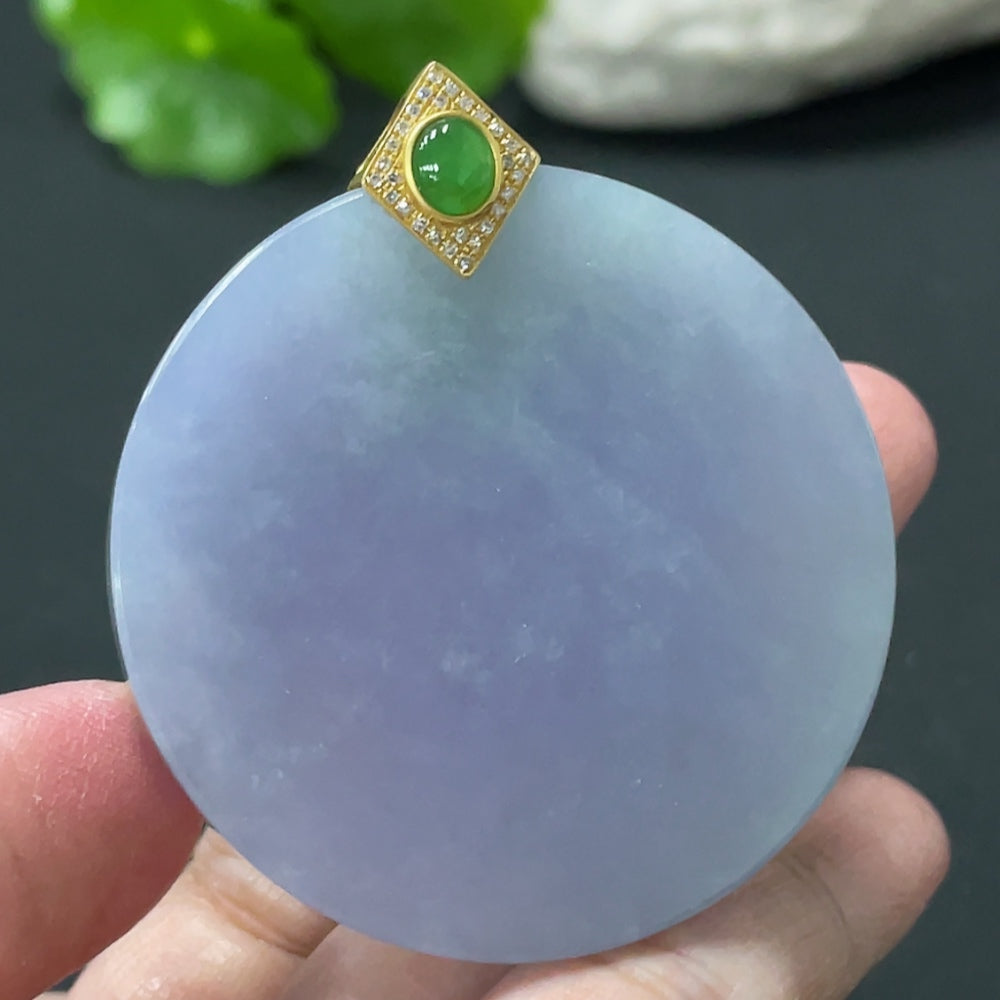 Jadeite plain pendant with 18K gold clasp and diamond accents, displayed on a jewelry stand, weight approx. 33.5g.