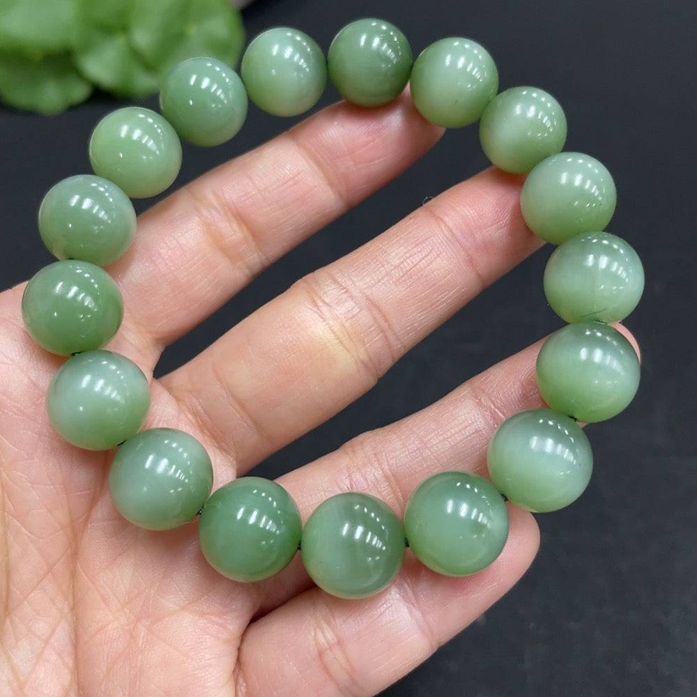 Hetian Jade Jasper bracelet with 11.7mm beads, crafted by HUILIU HQ, showcasing smooth, polished jade stones in a stylish design.