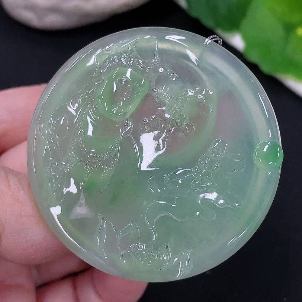 Huiliu certified jadeite Guanyin pendant featuring intricate carvings, displayed on a plain background.