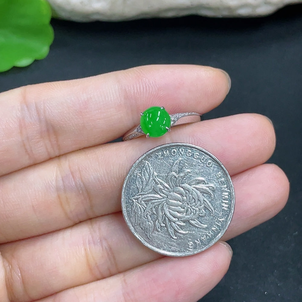 Jadeite ring with 18k gold band and diamond accents, size 13, showing the shank with natural color variations and details.