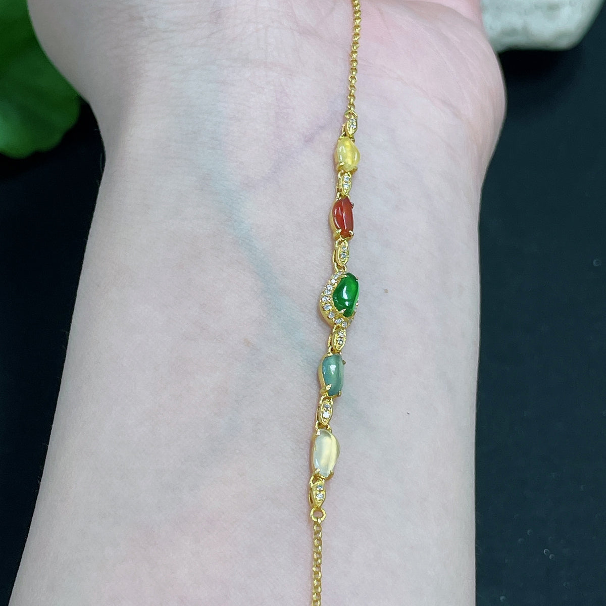 Jadeite bracelet by HKHQ with 18k gold inlay and diamond accents, featuring a delicate design and a total weight of 2.2 grams.