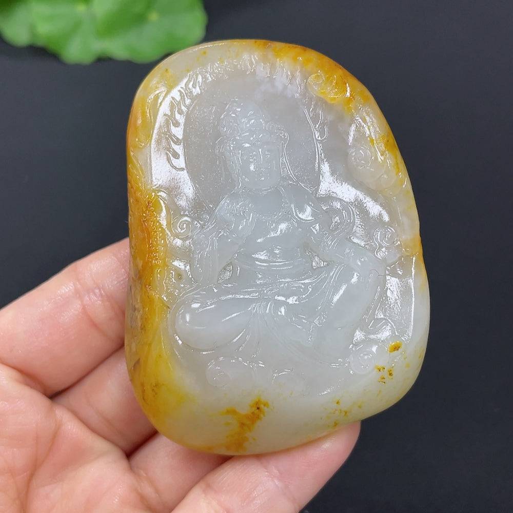 Huiliu Jade Guanyin pendant with undetermined skin color and mineral components, certified Hetian jade, featuring detailed carving.