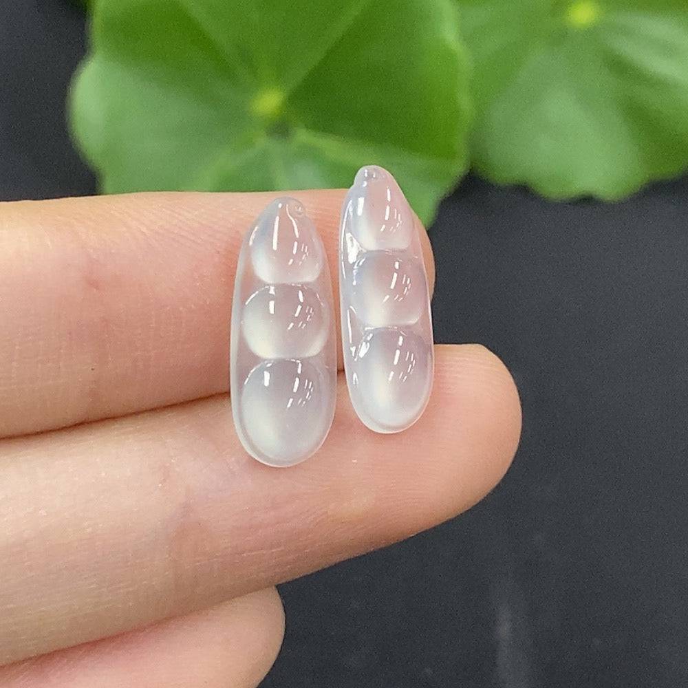 Jadeite auspicious bean inlay piece by HUILIU HQ, showcasing detailed craftsmanship and smooth jade surface.