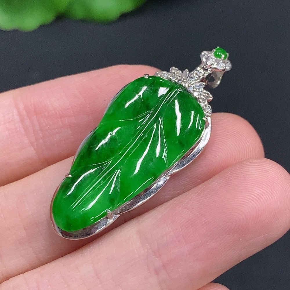 Jadeite leaf pendant with diamond accents, 18k gold, crafted by HUILIU HQ, weighs approx. 4g, featuring detailed leaf design.