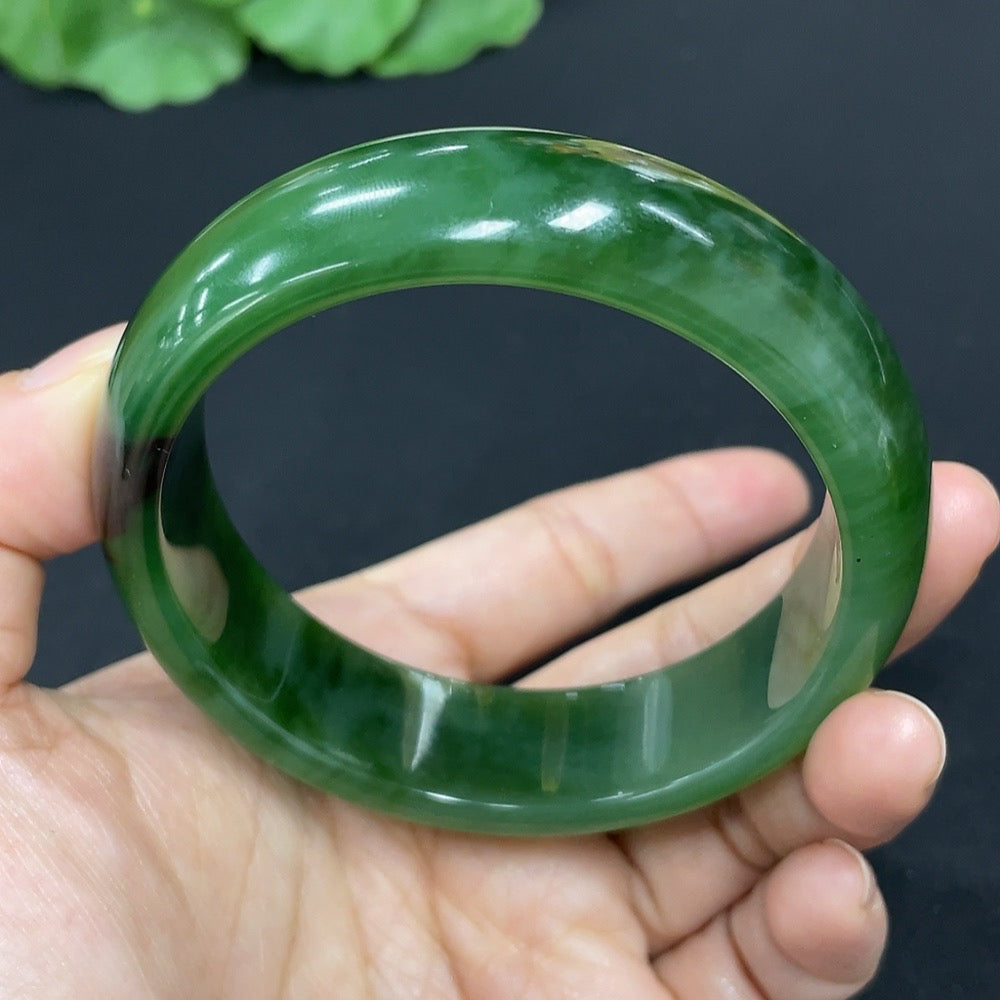 Green Hetian Jade round bangle bracelet from HKHQ featuring smooth, polished jade with a classic circular design.