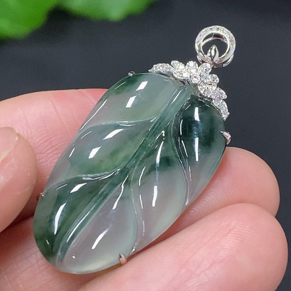 Huiliu Jadeite leaf inlay pendant with diamond accents, featuring intricate jade craftsmanship and elegant design.