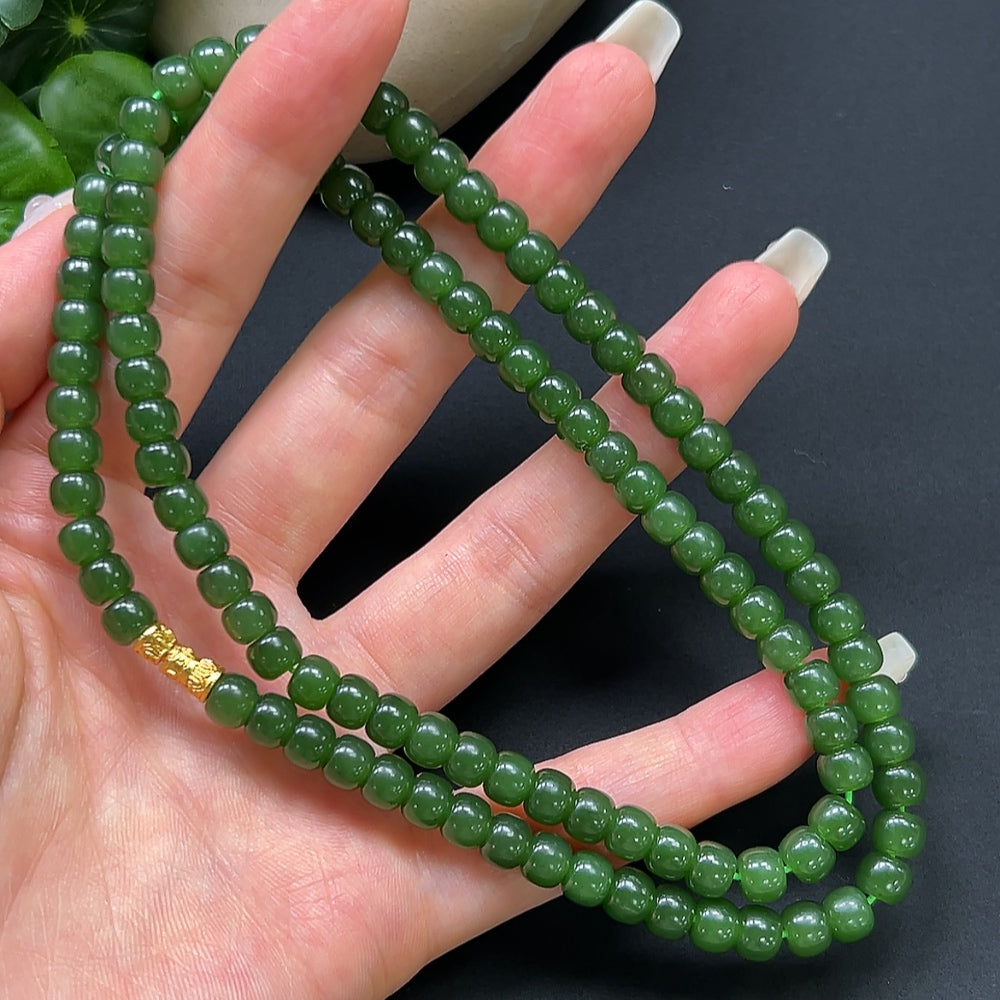 Hetian jade bead necklace by HKHQ featuring 6.2mm smooth, non-golden jade beads on a string.