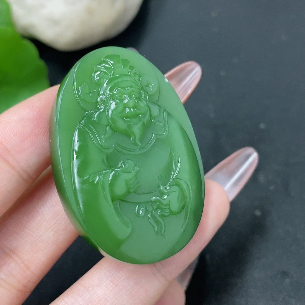 Hetian jade jasper pendant featuring the God of Wealth, weighing about 28g, with intricate natural stone details and polished finish.
