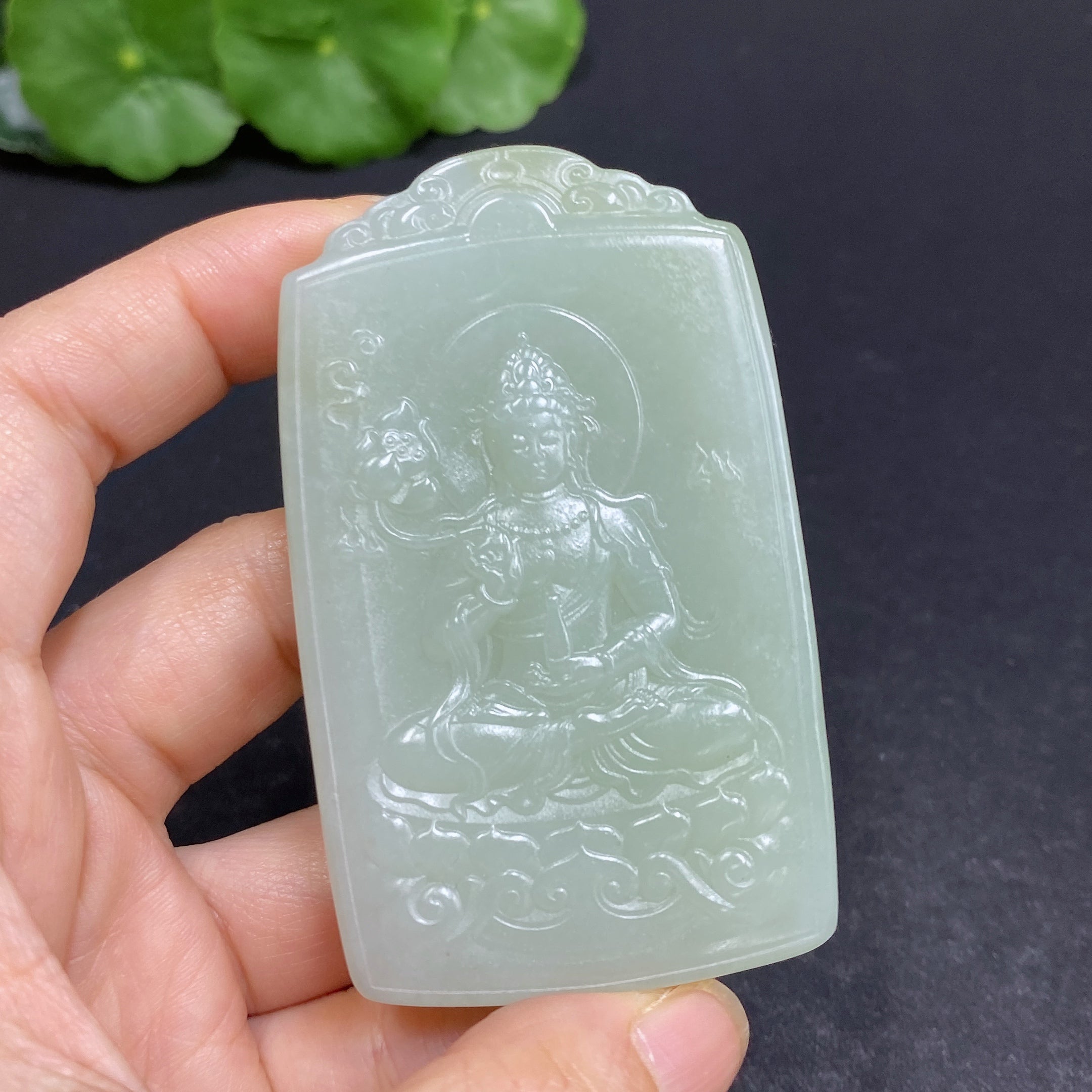 Huiliu Certified Hetian Jade Pendant featuring Guanyin figure, intricately carved and polished, showcasing fine jade craftsmanship.