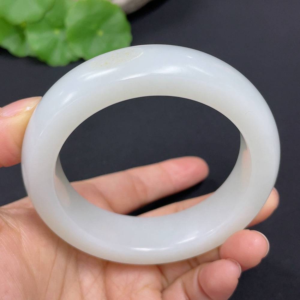 Hetian Jade round bracelet by HUILIU HQ, 56.3mm, approximately 88.8g, showcasing smooth jade beads on a neutral background.