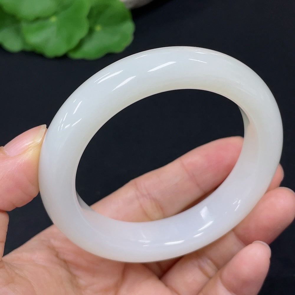 HKHQ Hetian Jade round bangle with a size of 52.2, showcasing smooth, polished jade bracelet with a natural green hue.