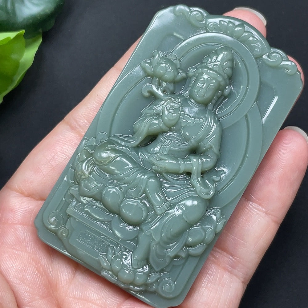 Beautiful Hetian Jade Jasper Guanyin pendant showcasing intricate carvings and a smooth, polished surface in natural jade tones.