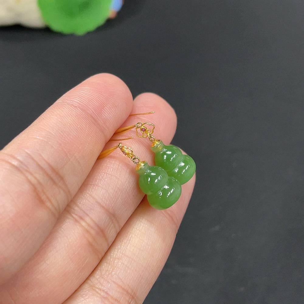 Huiliu certified Hetian jade earrings with carved gourd design, inlaid with jade, showcasing intricate craftsmanship.