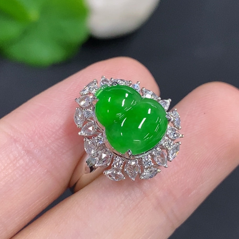 Jadeite gourd inlay ring by HKHQ featuring 18K gold setting and diamond accents, showcasing intricate craftsmanship and elegant design.