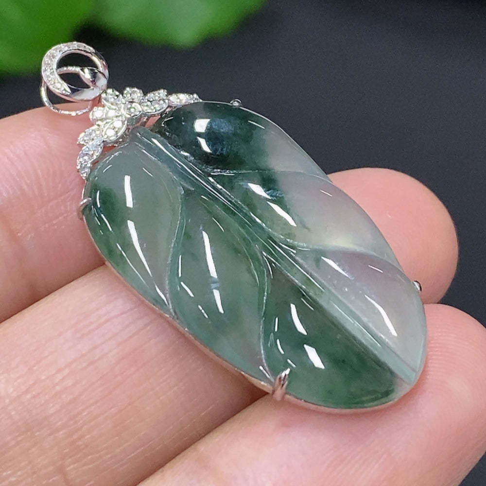 Huiliu Jadeite leaf inlay pendant with diamond accents, featuring intricate craftsmanship and a polished jade jadeite finish.