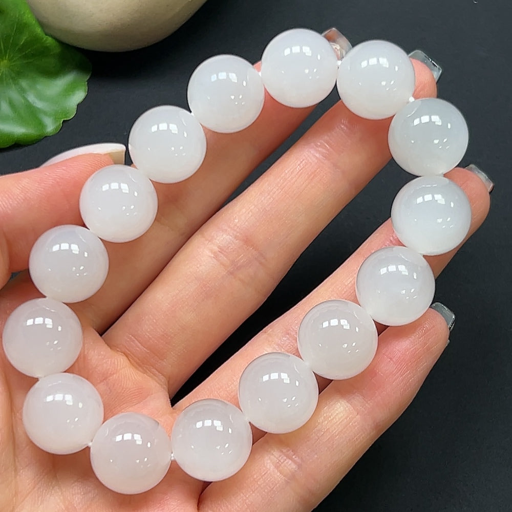 HKHQ Hetian jade bracelet with 14mm beads, featuring smooth, polished green jade stones on a delicate string.