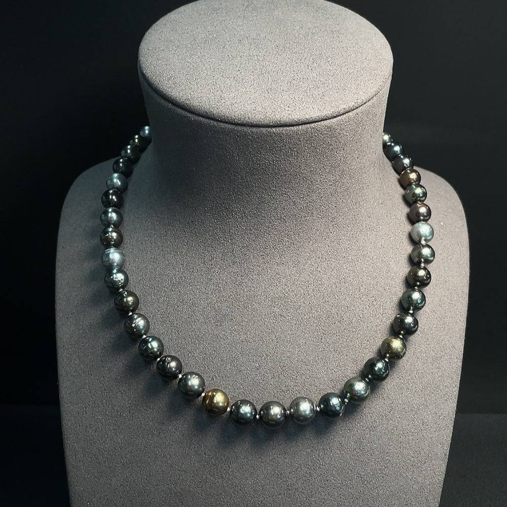 Huiliu certified seawater pearl strand with 9.4mm pearls, natural luster, and elegant design.