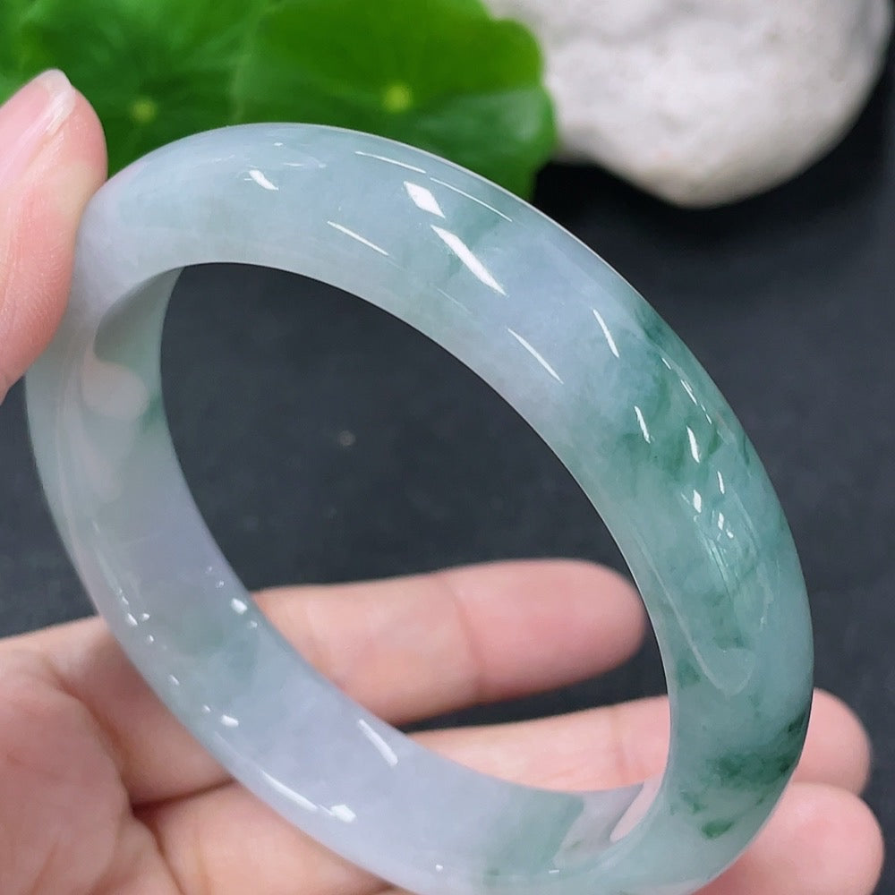 HKHQ jadeite round bangle with a smooth finish, size 54.7mm, approximately 52.26g, showcasing vibrant green jade jewelry.