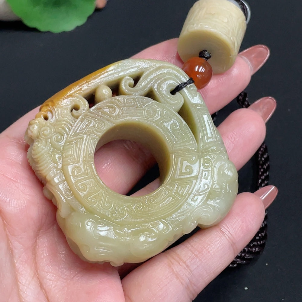 Huiliu HQ Hetian Jade handheld carving in antique style, showcasing intricate craftsmanship and smooth, polished surface.