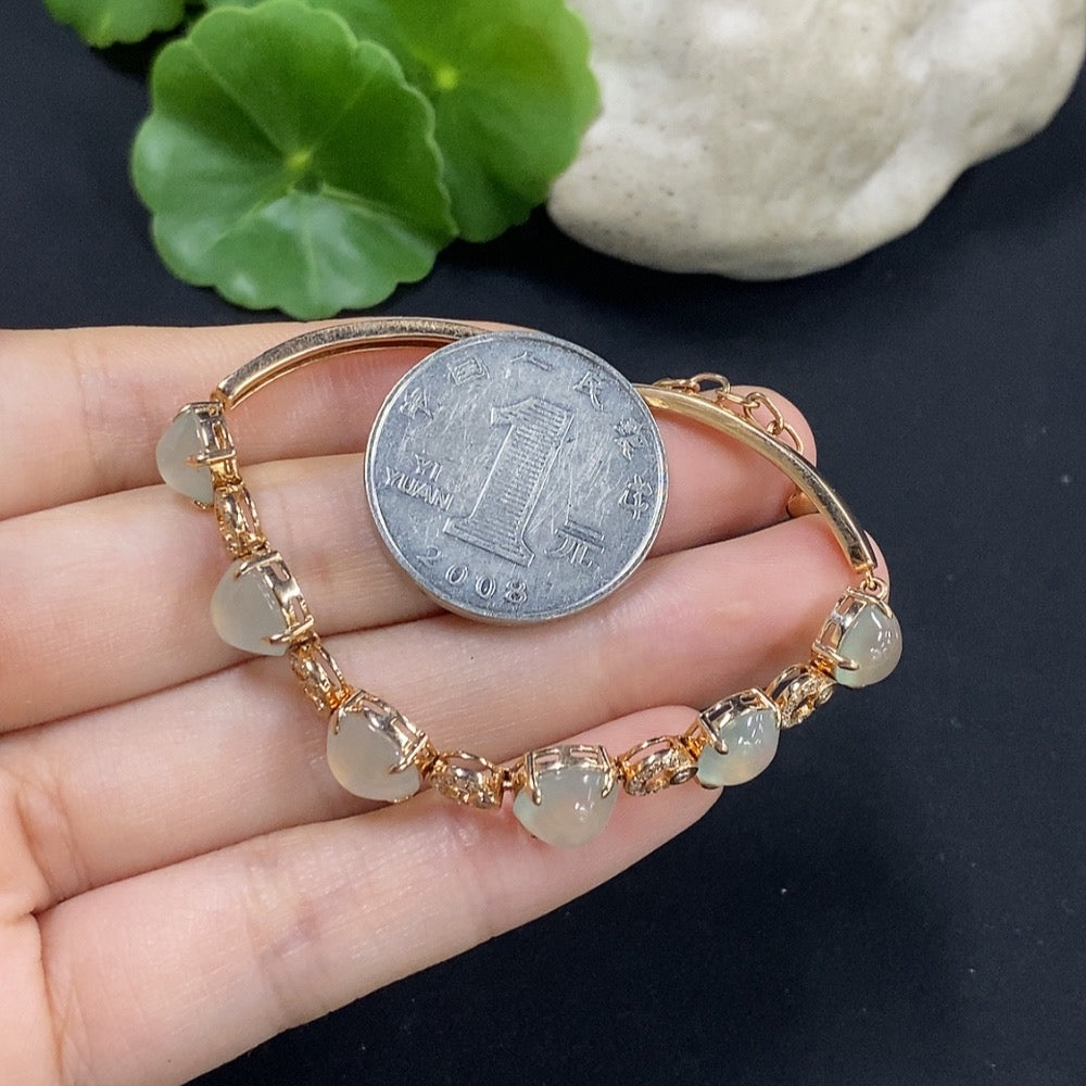 Jadeite cabochon bracelet set in 18K gold with diamond accents, total weight approximately 10.85g