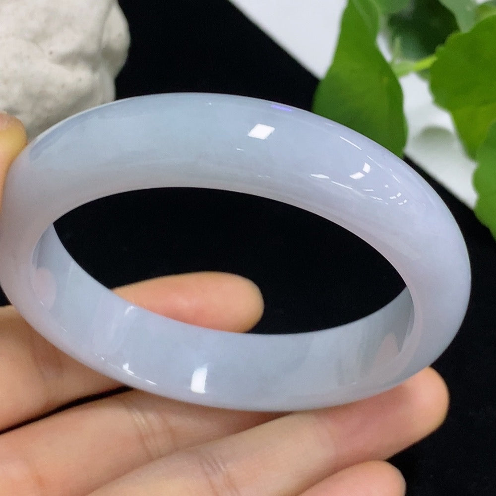Jadeite round bangle in size 54.5 with approximately 52.66g weight, crafted by HKHQ, showcasing smooth, polished jade surface.