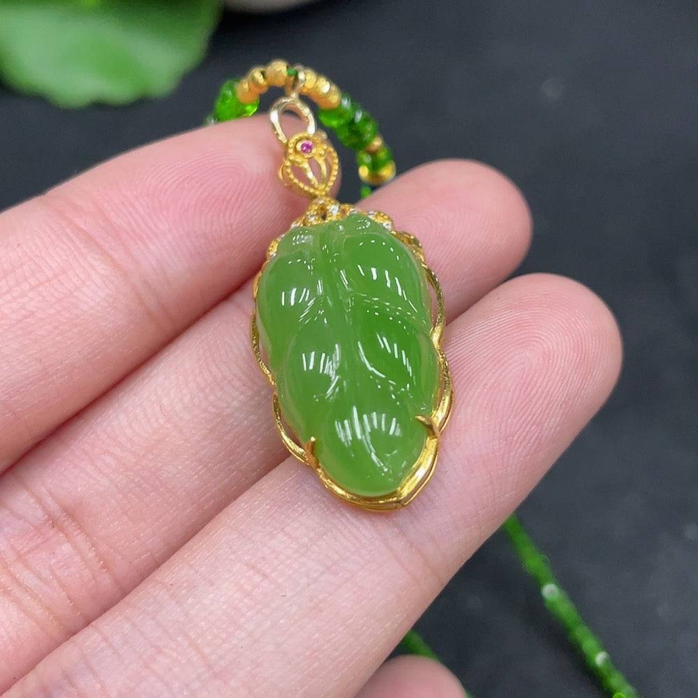 Hetian jade jasper leaf pendant with gold accents and non-Hetian jade beads, featuring intricate inlay and natural gemstone details.