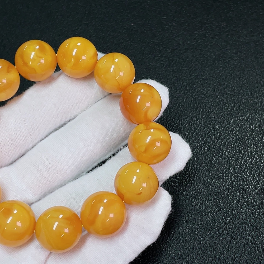 호박 밀랍 팔찌, 총 중량 약 31.24g, 크기 약 16mm, 색상 출처 미확인
