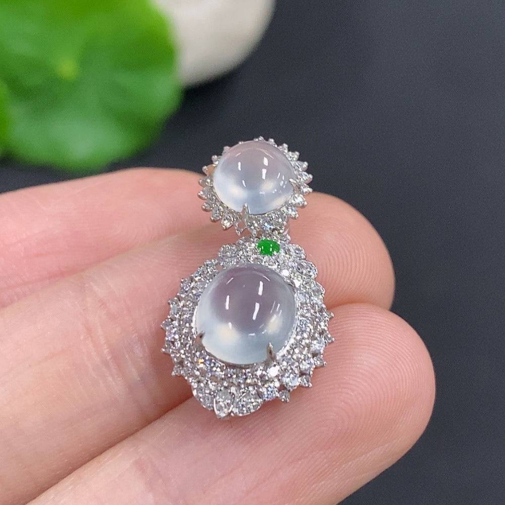Jadeite bezel-set cabochon pendant with 18k gold frame and diamond accents, featuring a polished green jade stone.