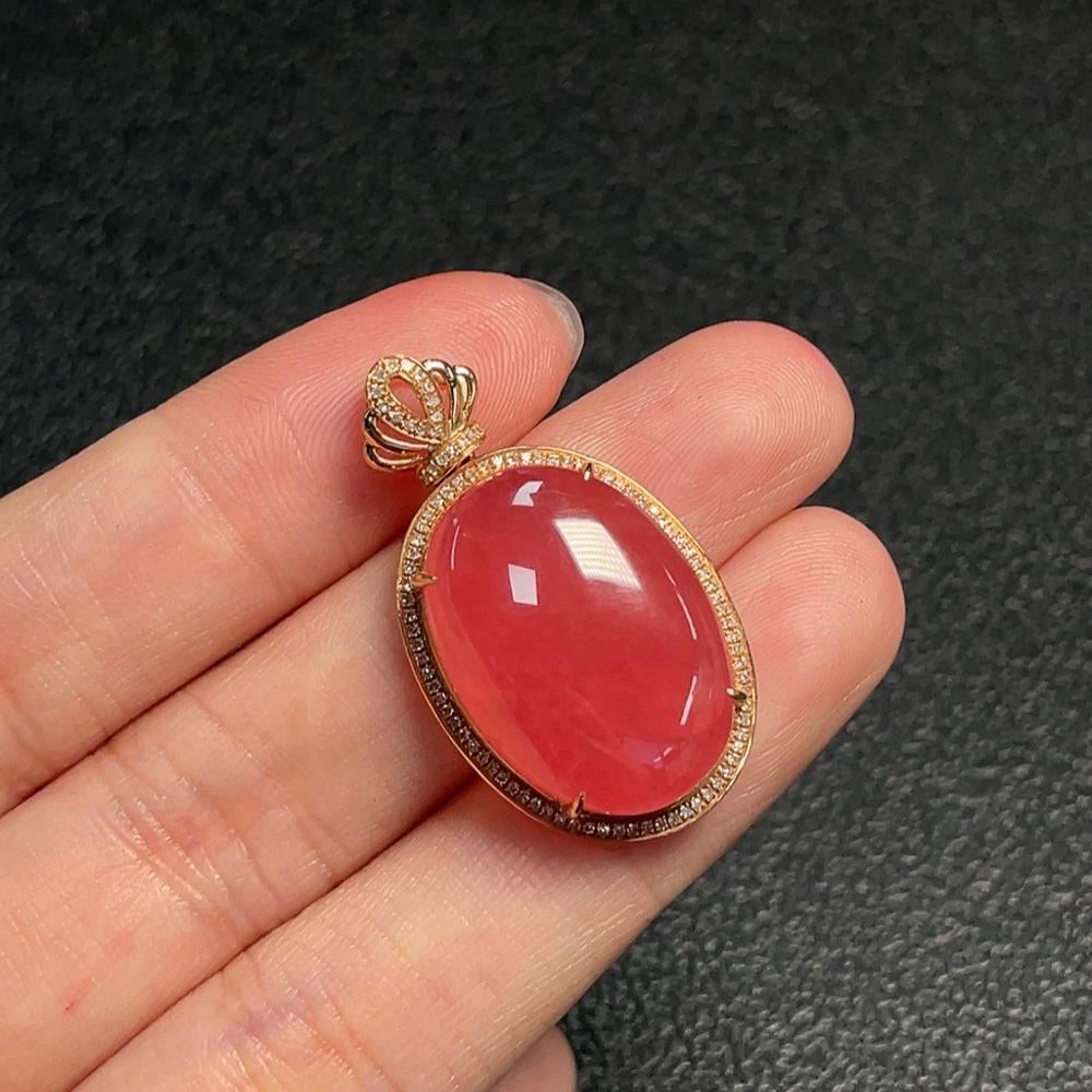 Huiliu Rhodochrosite pendant with diamond accents, showcasing vibrant pink gemstone and sparkling details on a silver chain.