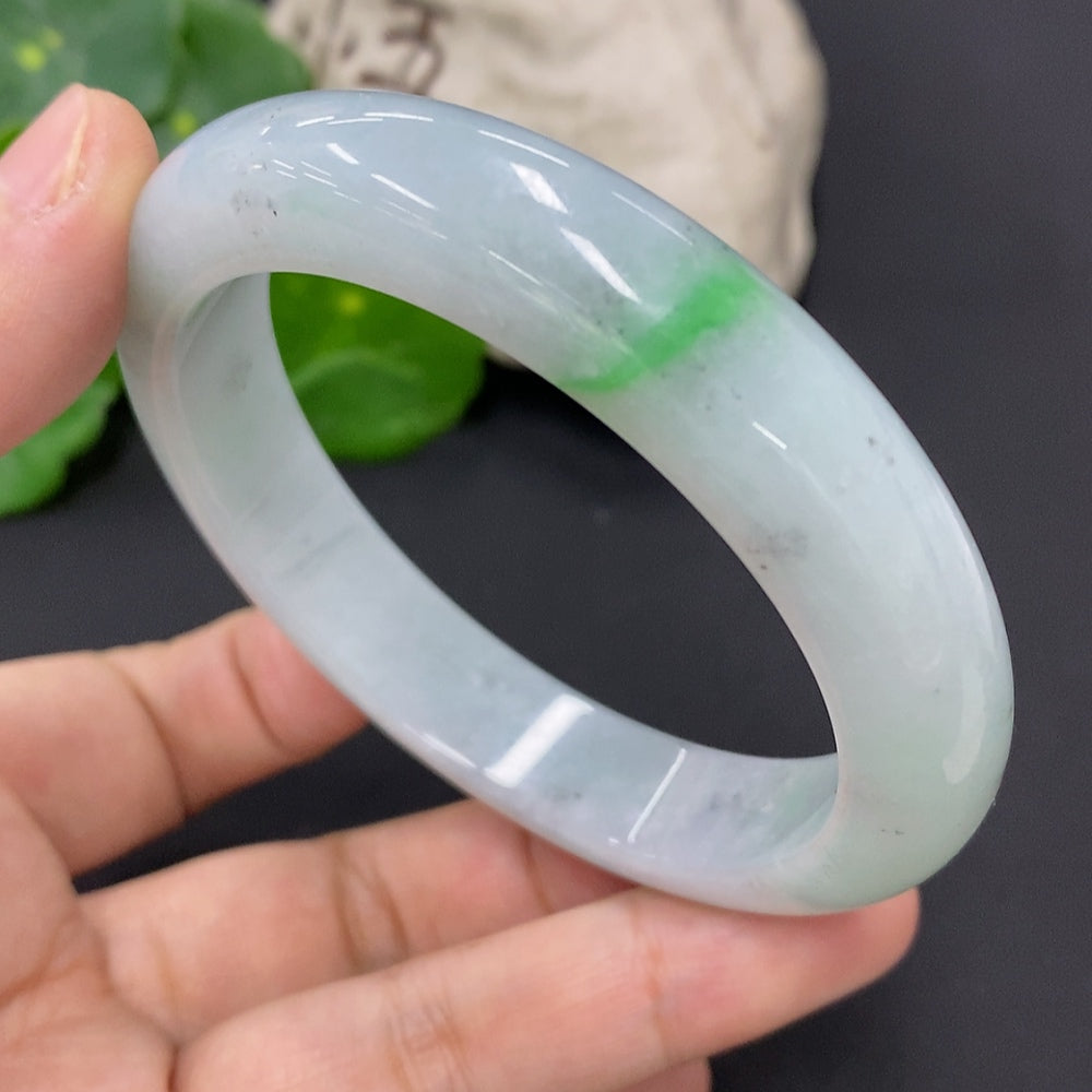 Jadeite round bracelet by HKHQ, size 58.2, weighing approximately 64.1g, featuring smooth, polished jade stones.