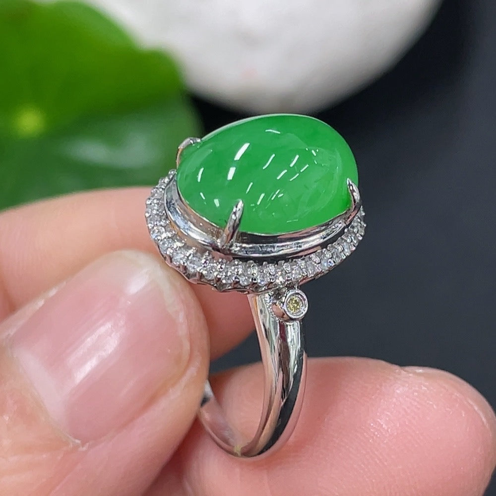 Jadeite cabochon ring with diamond accents in 18K gold, size 9, featuring a polished green jade stone and gold band.