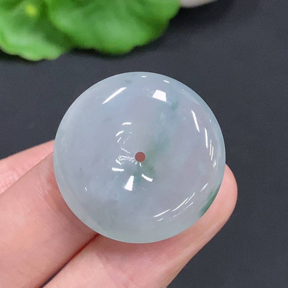 Jadeite Peace Knot pendant by HUILIU HQ, 7.4g, featuring smooth green jade with intricate knot design on a plain background.