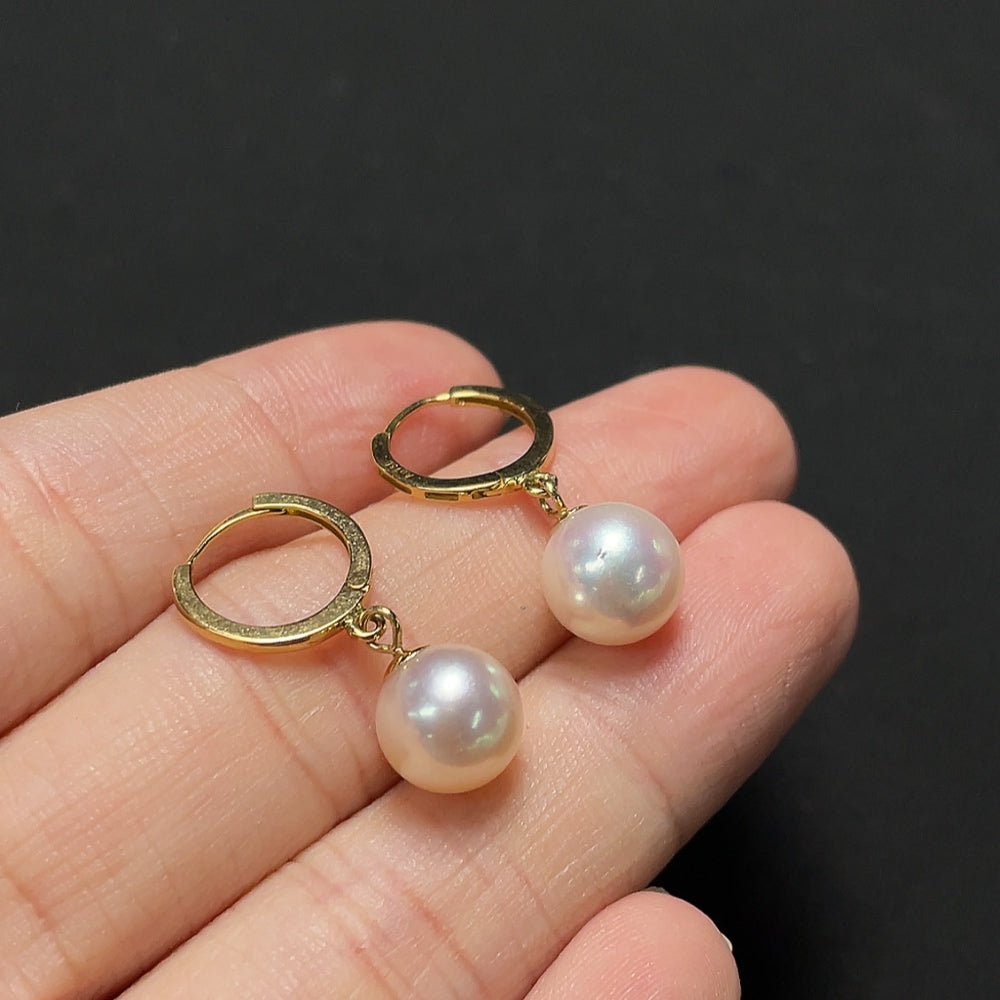Saltwater pearl earrings with 18K gold setting by HKHQ, featuring lustrous pearls and elegant design.