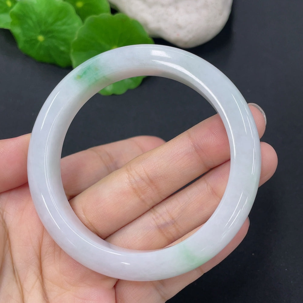 HKHQ jadeite round bangle with a 52.5mm size and approximately 46g weight, showcasing smooth, polished jade surface.