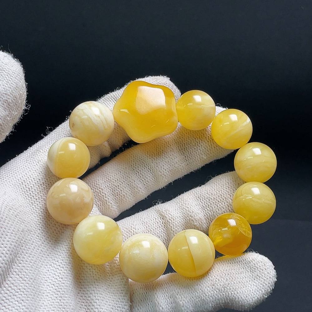 Huiliu Amber Beeswax bracelet with 15.1mm size, crafted from natural amber, showcasing warm golden tones and smooth beads