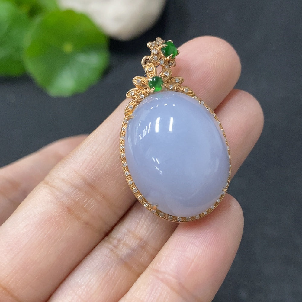 Jadeite bezel-set cabochon pendant with 18k gold and diamond accents, showcasing a polished green jade gemstone from HUILIU HQ.