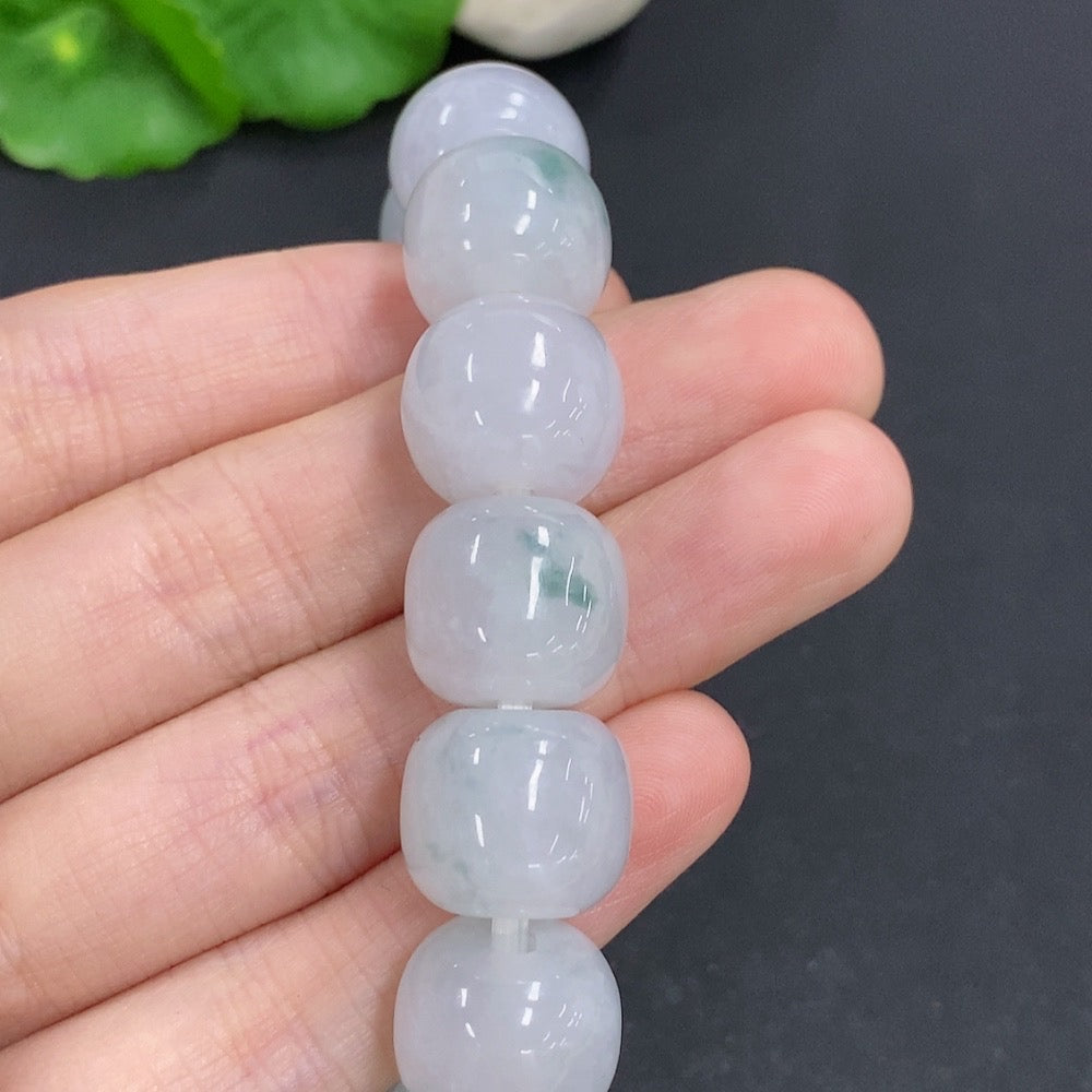 HKHQ jadeite bracelet weighing 83.3g, featuring smooth, polished jadeite beads arranged in a stylish bracelet design.