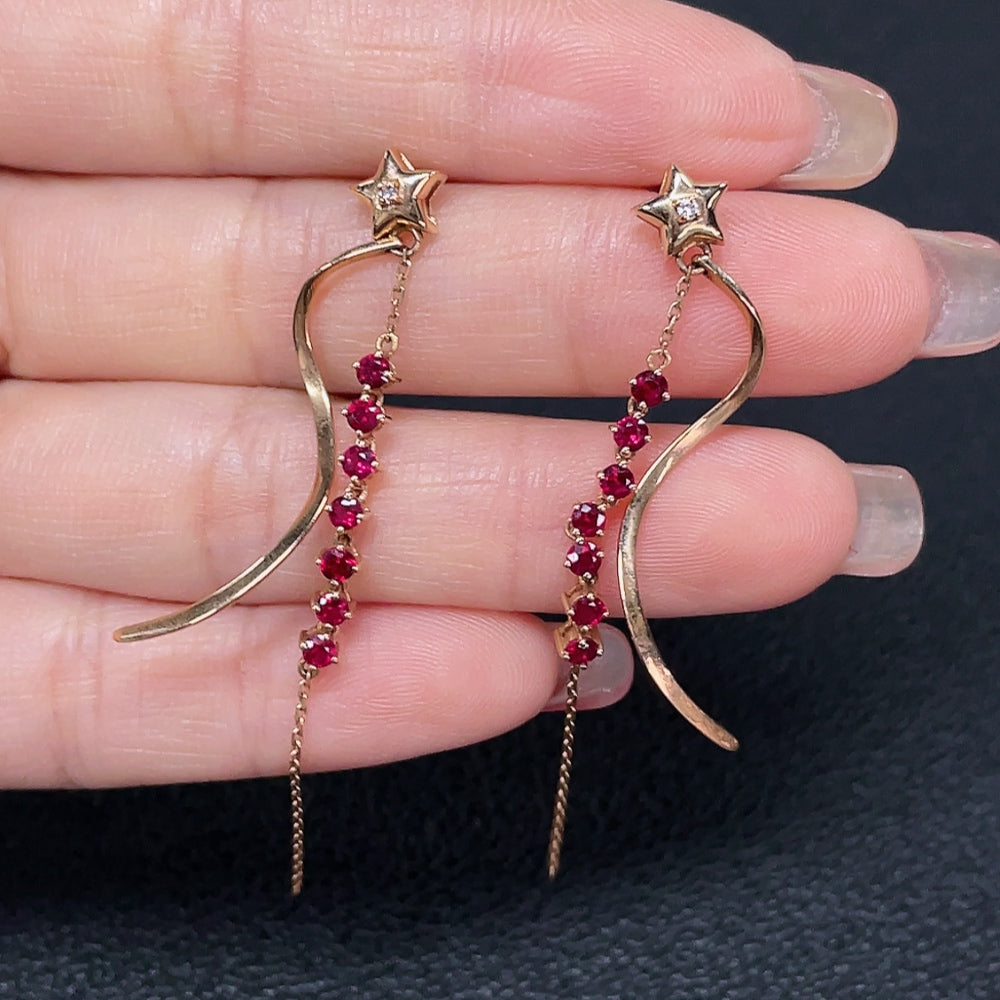 HUILIU HQ Ruby earrings with 18k gold and diamond accents, showcasing vibrant red gemstones and elegant craftsmanship.