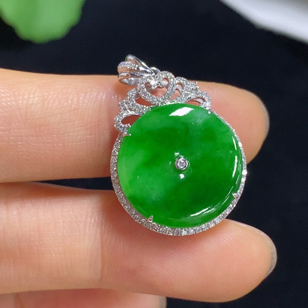 Jadeite peace knot pendant by HUILIU HQ with 18k gold and diamond accents, showcasing intricate inlaid design and smooth jade surface.