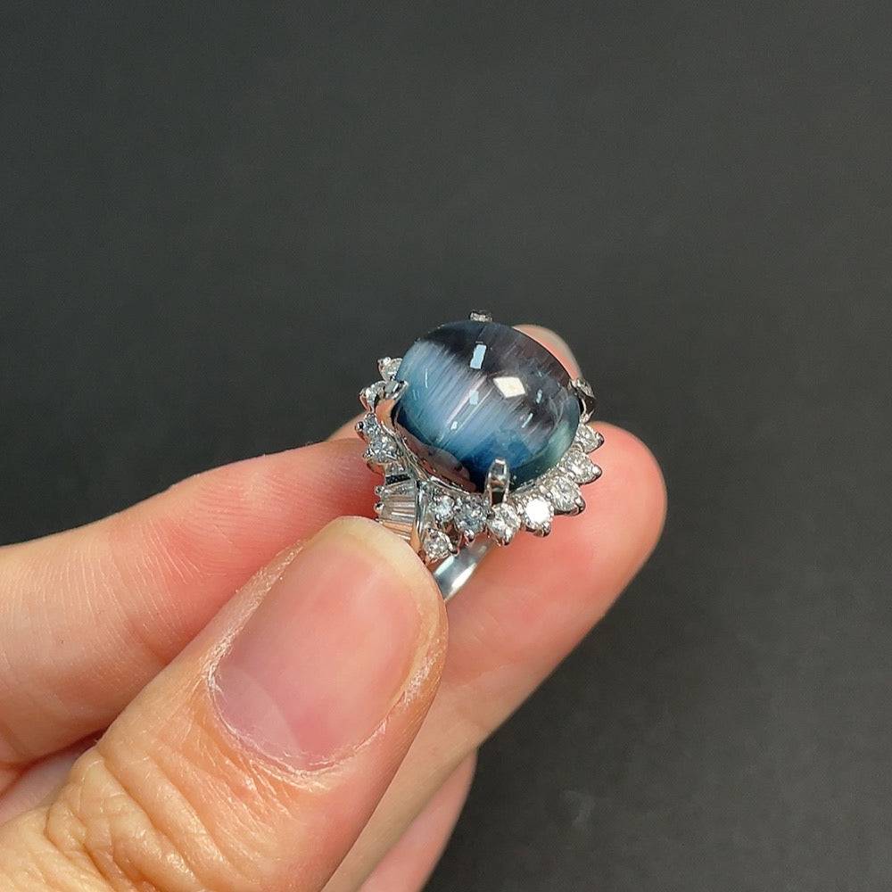 Huiliu Tourmaline inlaid gemstone ring with organic material diamond accents, platinum setting, and certified quality.