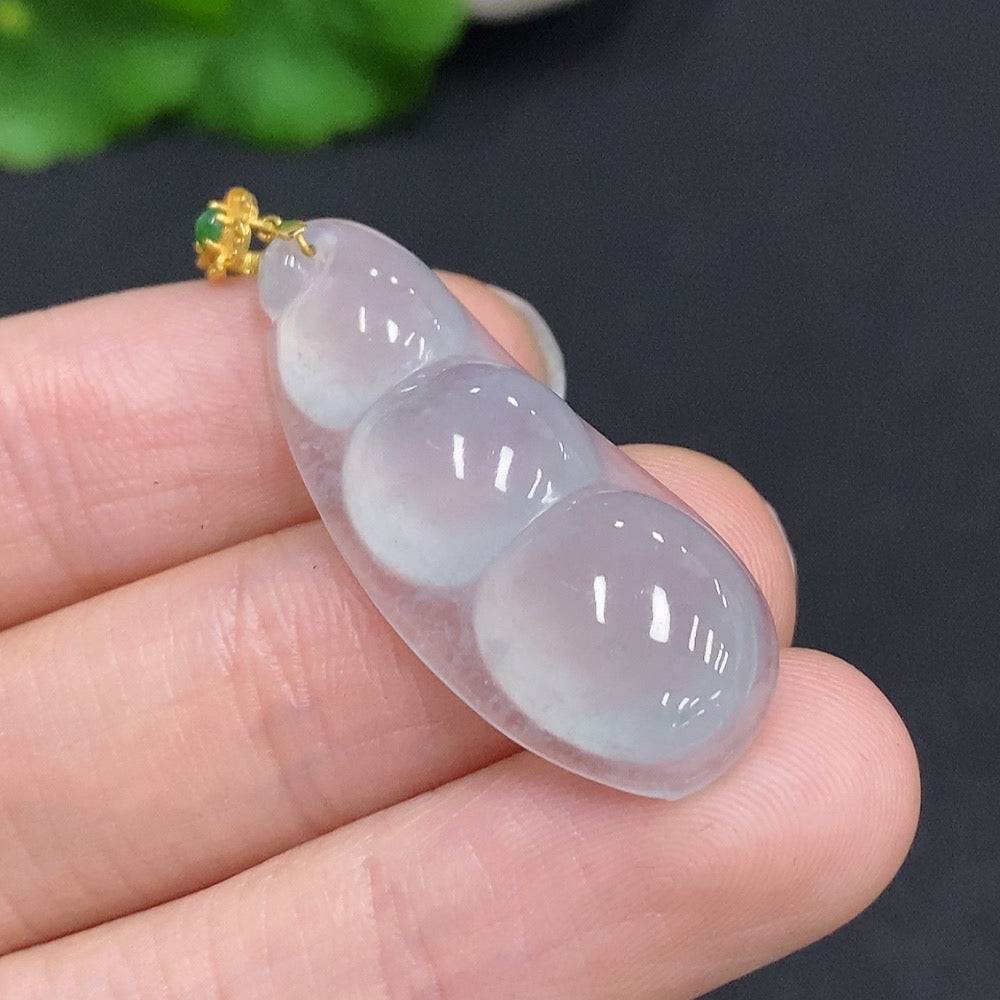 Jadeite lucky bean pendant with 18K gold clasp and diamond accents, showcasing a smooth green jade stone, from HUILIU HQ.